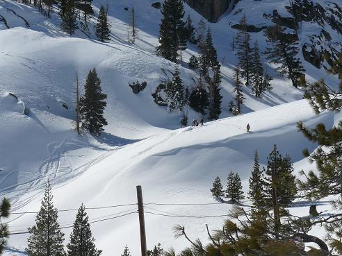 Snowboarders hiking up Shallenberger Ridge from Old Hwy 40 in Truckee, CA