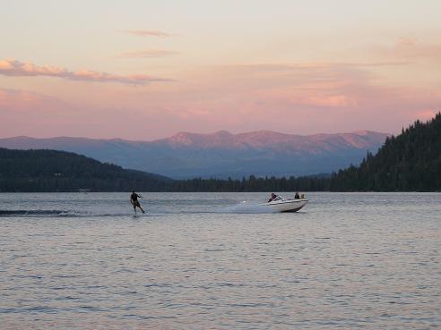Waterskiing on Donner Lake at sunset in Truckee, California